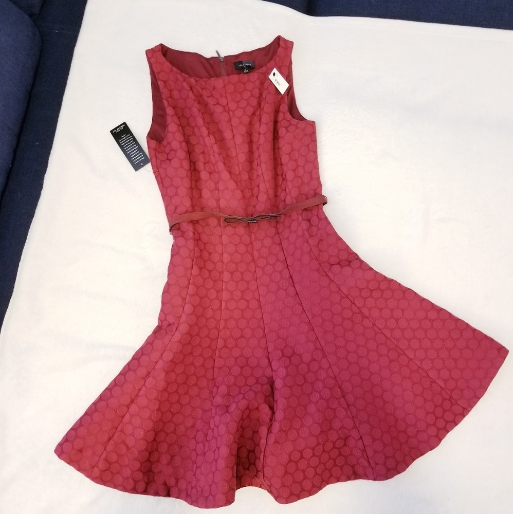 Belted dress with wide skirt